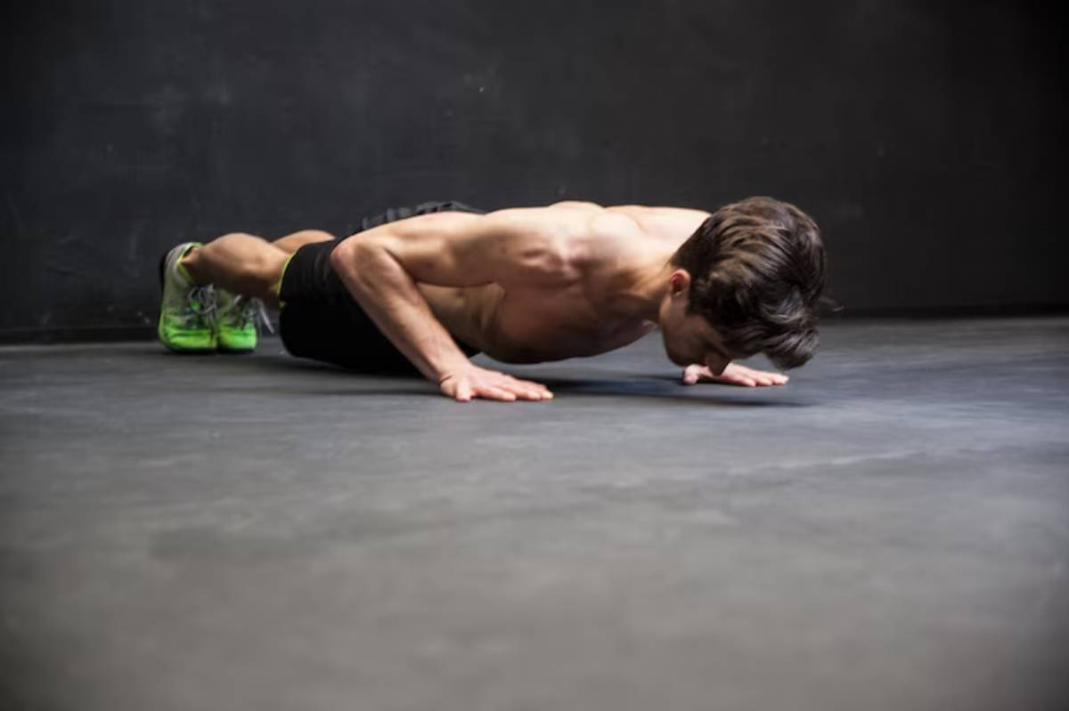A man doing a push -ups to fit herself