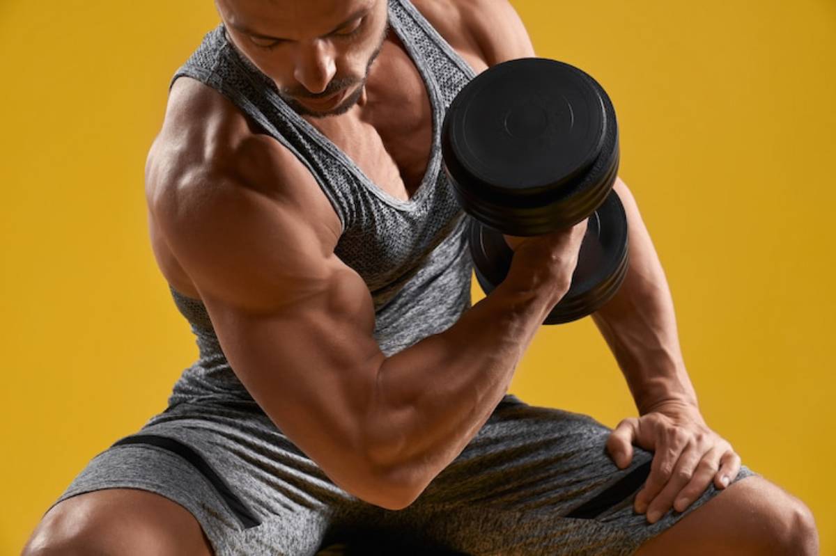 A muscular person lifts a dumbbell, showcasing arm strength against a vibrant yellow background.